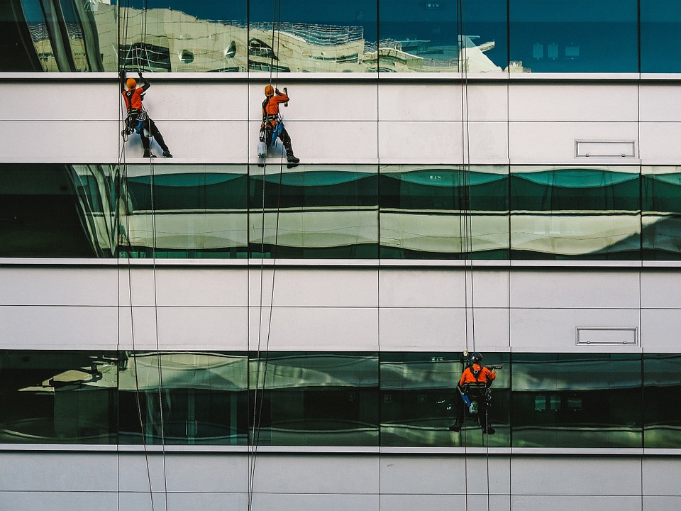 men cleaning building windows