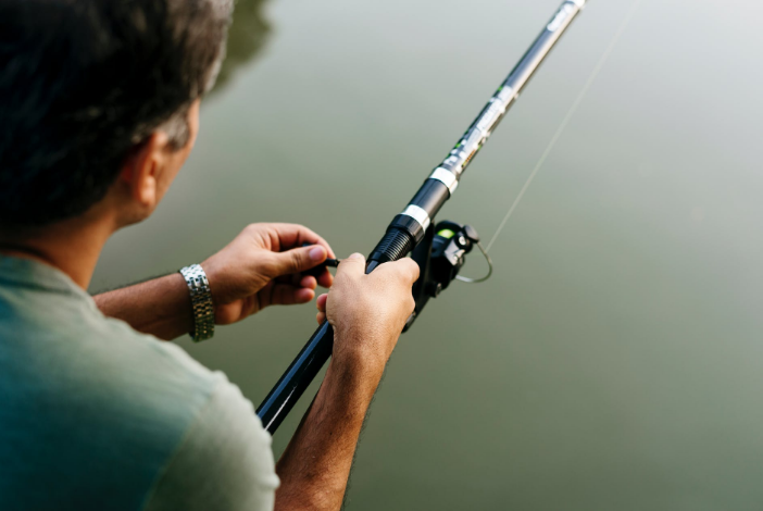 a person fishing on a lake